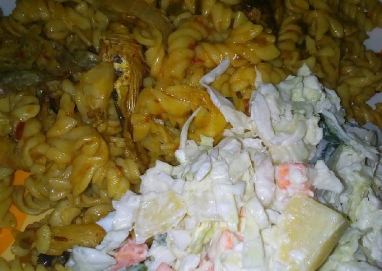 Macaroni jollof with fish and potato salad