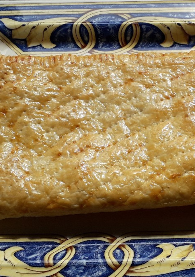 Una foto de Empanada de jamón serrano y cabello de ángel