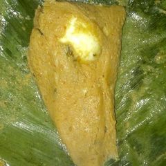 A picture of Moi moi in banana leaves.