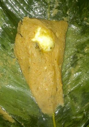 A picture of Moi moi in banana leaves.