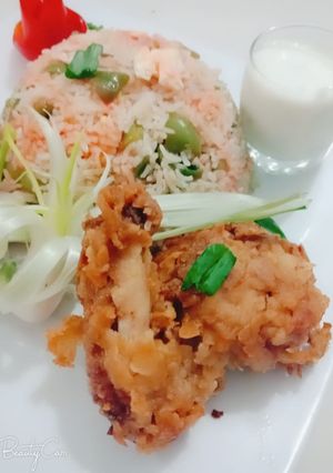 A picture of Chicken broast with vegetable rice.