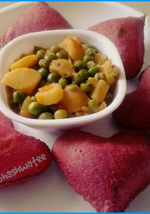 A picture of Beetroot poori and potato green peas dry sabzi.