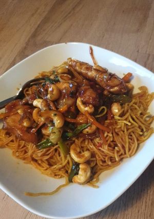 A picture of Honey Chilli Chicken with Curry Noodles.