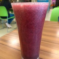 A picture of Grapes and beetroot juice.
