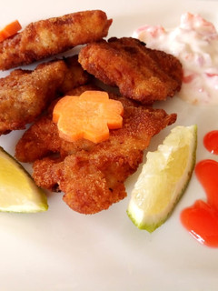 A picture of Grilled fish marinade in tartar sauce.