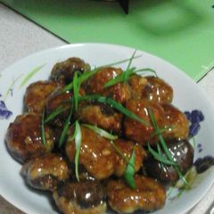 A picture of Mushroom stuffed minced fish.