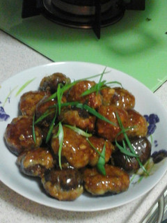 A picture of Mushroom stuffed minced fish.