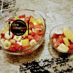 A picture of Fruits salad with mint leave sugar syrup.