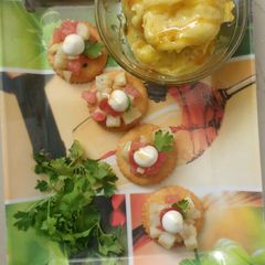 A picture of Mango honey almond icecream with monaco bites.