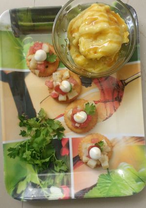 A picture of Mango honey almond icecream with monaco bites.