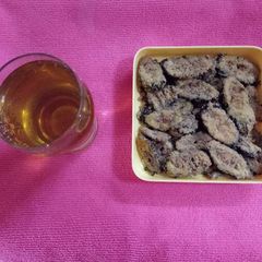 Karela chips with apple juice (bitter guard chips) A picture of Karela chips with apple juice (bitter guard chips).