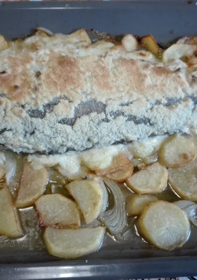 Una foto de Merluza rellena de gambas y gulas