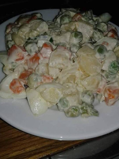 A picture of Coleslaw with irish potatoes salad cream.