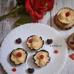A picture of Kheer puli in chocolate cups.