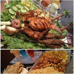 A picture of Sizzling Bar b que platter, Bandoo Khan parathe, sauce & salad.