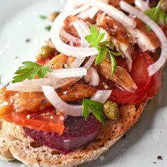 Cured Mackerel On Sourdough With Tomatoes, Beetroot & Onion A picture of Cured Mackerel On Sourdough With Tomatoes, Beetroot & Onion.