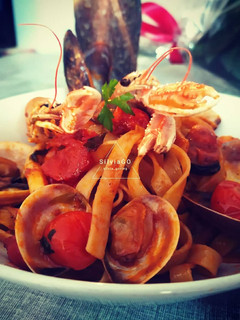 Una foto de Tagliatelle/tallarines frutti di mare