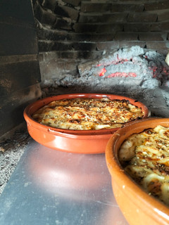 Una foto de Lasaña al horno de leña