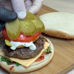 A picture of Veal Burger with Fried Potatoes.