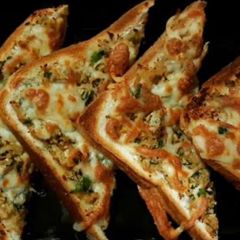 A picture of Air fried toast with chicken n cheese.