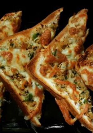 A picture of Air fried toast with chicken n cheese.