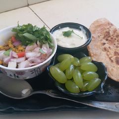 A picture of Healthy masala paratha and boiled moong sprouts.