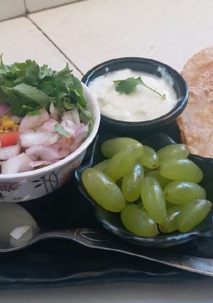 A picture of Healthy masala paratha and boiled moong sprouts.