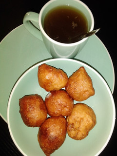 A picture of Puff puff with black tea.