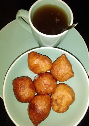 A picture of Puff puff with black tea.