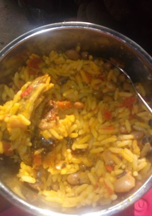 A picture of Palm oil rice and beans.