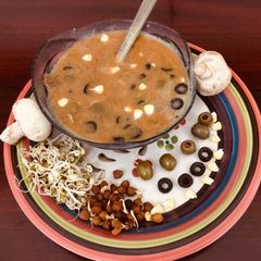 A picture of Mushroom Sprouts with Olive soup.