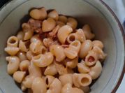 A picture of penne pasta and bacon