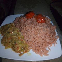 A picture of Tomato rice with cabbage and egg source.