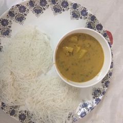 A picture of Idiyappam with stew.