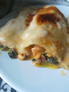Una foto de Canelones de espinacas y jamón