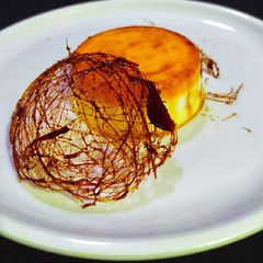 A picture of Mango Pudding with Spun Sugar Decoration.