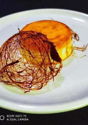 A picture of Mango Pudding with Spun Sugar Decoration.