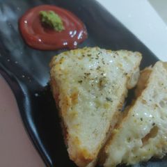 A picture of Melting cheese sandwich.