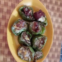 A picture of Stuffed capsicum with corn potato fry.