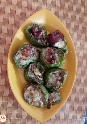 A picture of Stuffed capsicum with corn potato fry.