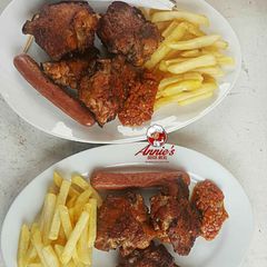 A picture of Bbq Turkey,sausage and Chips with pepper sauce.