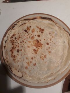Una foto de Panqueques envueltos en manjar