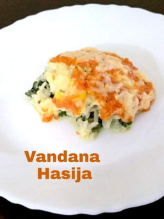 A picture of Layered Corn,Spinach Rice With Tomato Sauce.
