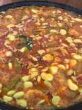 Paella de pato y conejo