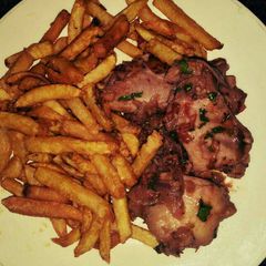 A picture of Chicken with chips.