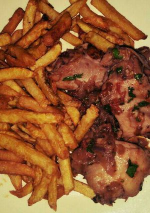 A picture of Chicken with chips.