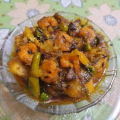 A picture of Cabbage with shrimp curry.