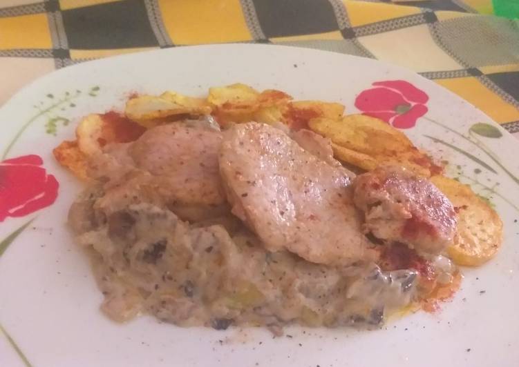 Solomillo de cerdo con salsa de champiñones y papas dolar