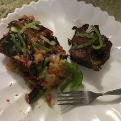 A picture of Mashed potatoes with Veggies and mince meat.