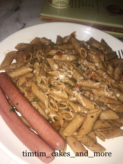 A picture of Penne in hot tomato and herb sauce.